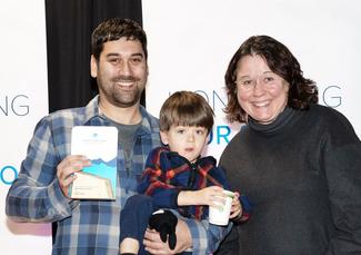 Graham Sakaki receives the award for Leadership & Innovation from VIU President Deb Saucier